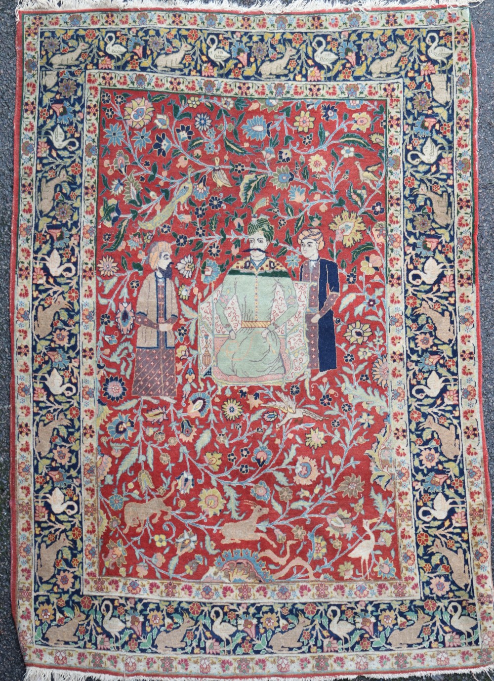 A Caucasian red ground rug, 6ft by 4ft 7in.